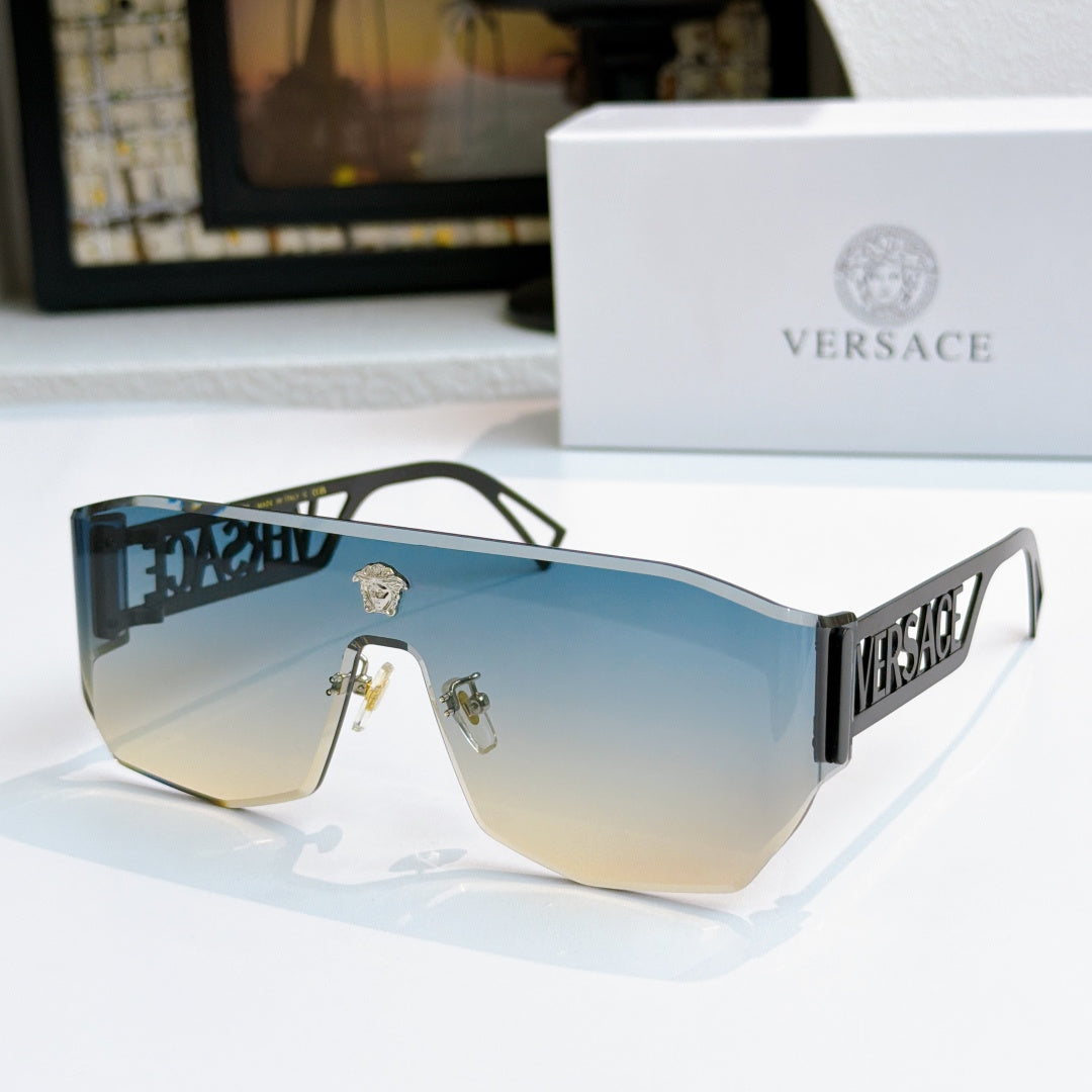 Gold-framed sunglasses with blue-to-amber mirrored lenses and Versace logo arms