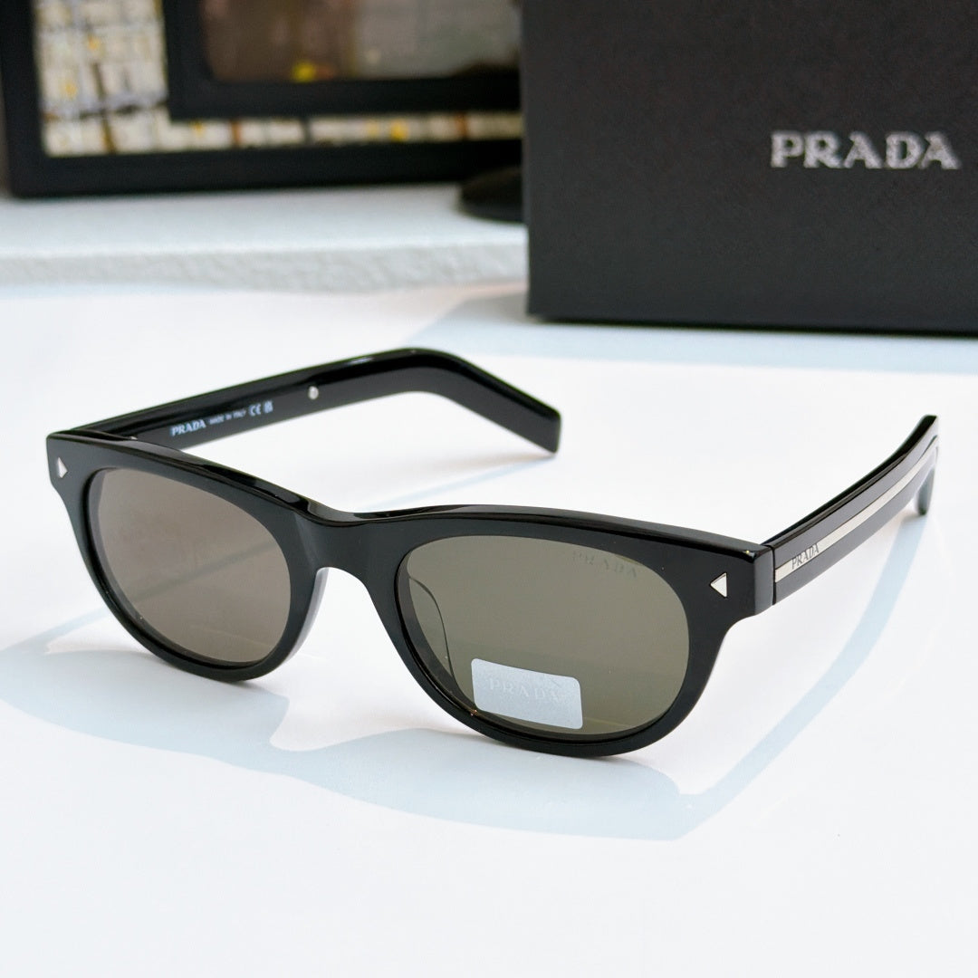 Prada sunglasses side view with black frames and tinted lenses, logo on temple
