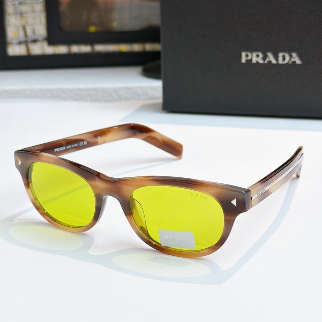 Prada sunglasses with tortoise frames and bright green lenses, logo on side temple