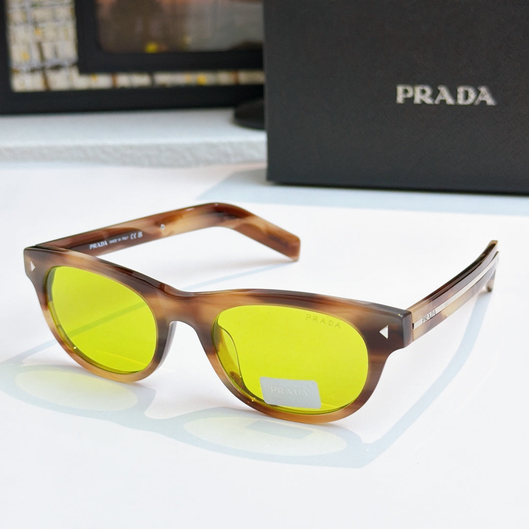 Prada sunglasses with tortoise frames and bright green lenses, logo on side temple
