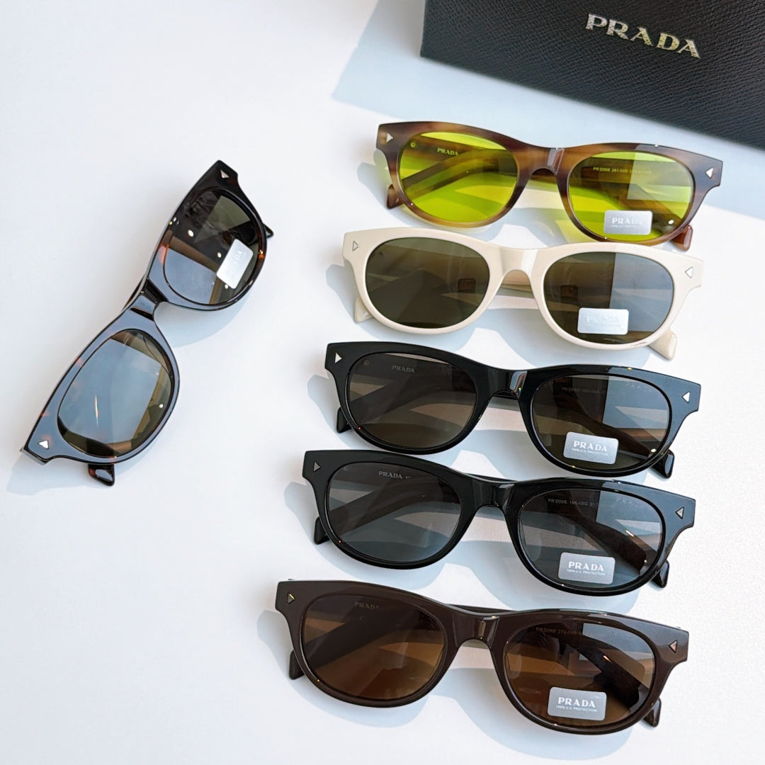 Prada sunglasses collection with various frames and tinted lenses on display
