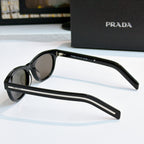 Prada sunglasses side profile with black frames and dark lenses, slim temple branding