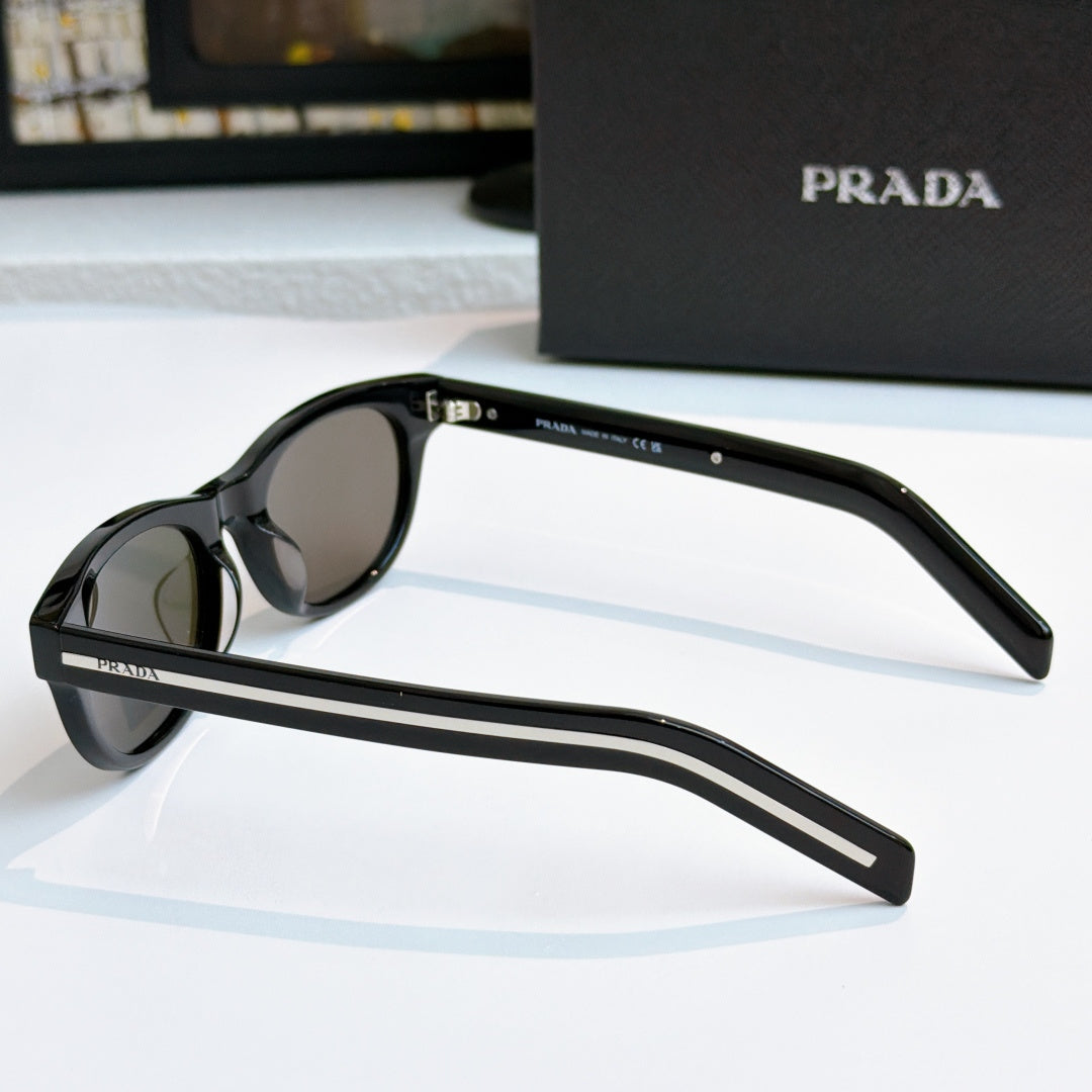 Prada sunglasses side profile with black frames and dark lenses, slim temple branding