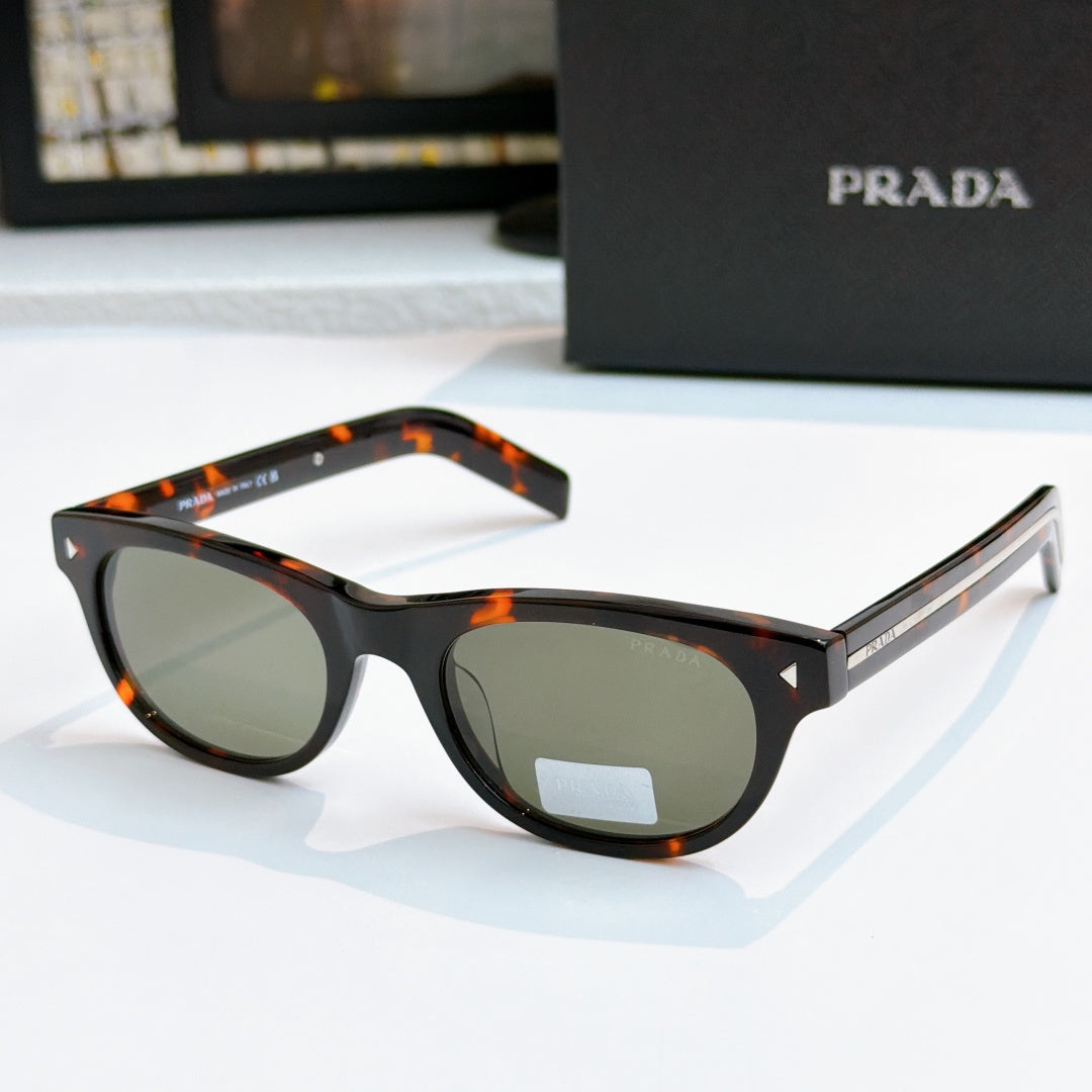 Prada sunglasses with black frames, dark lenses, and logo detail on temple