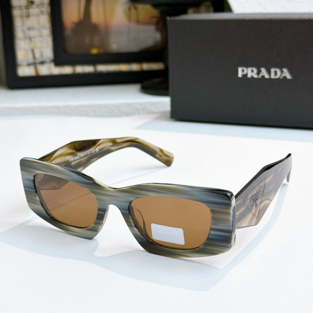Prada tortoise glasses with amber tinted lenses and angular temples