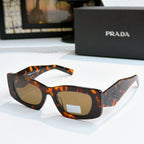 Prada orange tortoise glasses with amber tinted lenses and angled arms