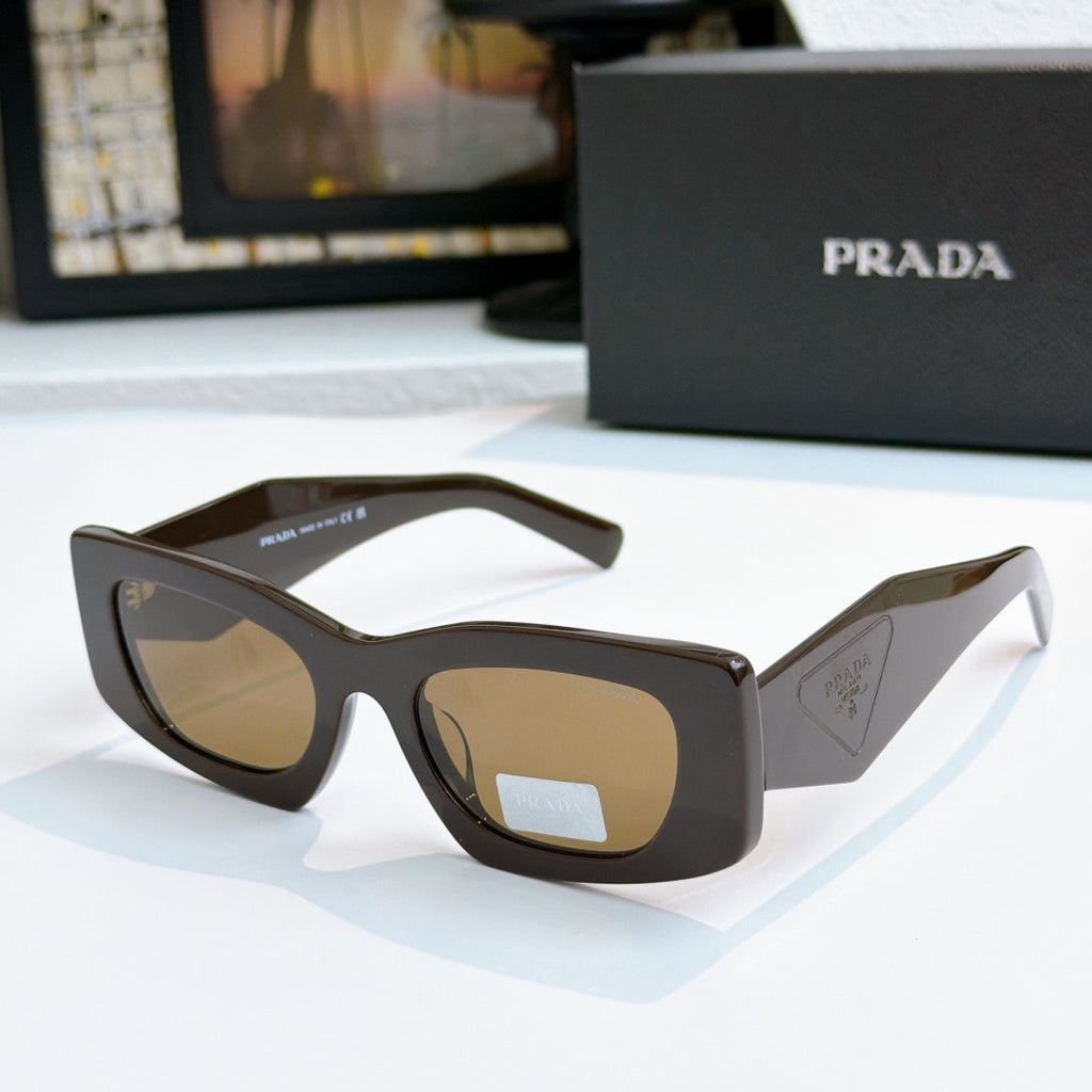 Prada tortoise glasses with warm amber tinted lenses and curved temples