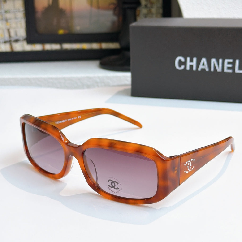 Tortoiseshell cat-eye glasses with dark pink tinted lenses