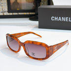 Tortoiseshell cat-eye glasses with dark pink tinted lenses
