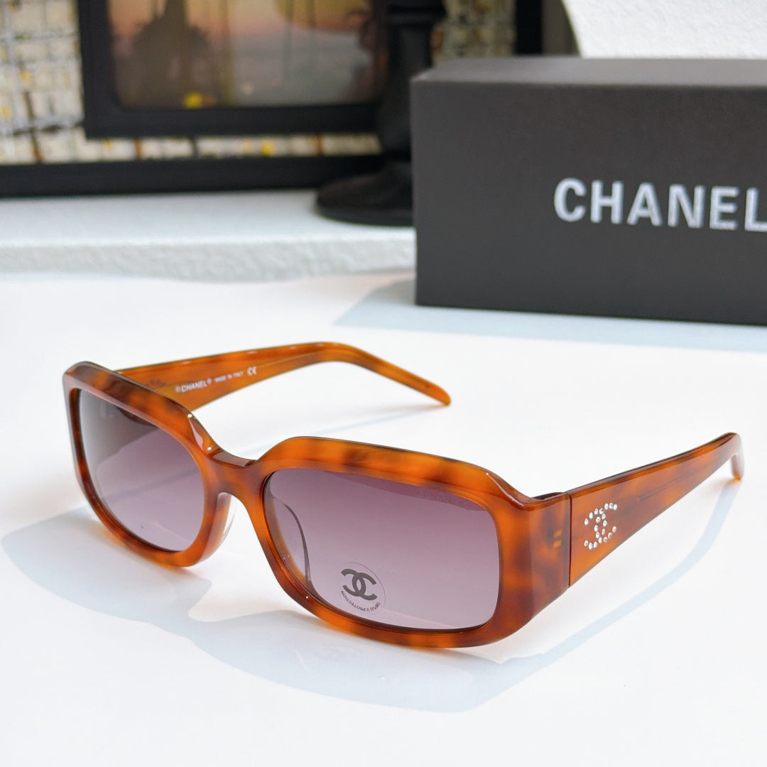 Tortoiseshell cat-eye glasses with dark pink tinted lenses