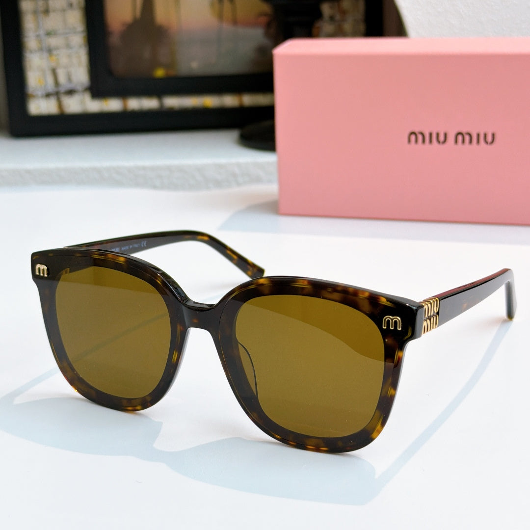 MiuMiu tortoise cat-eye sunglasses with amber lenses and gold-tone hinges