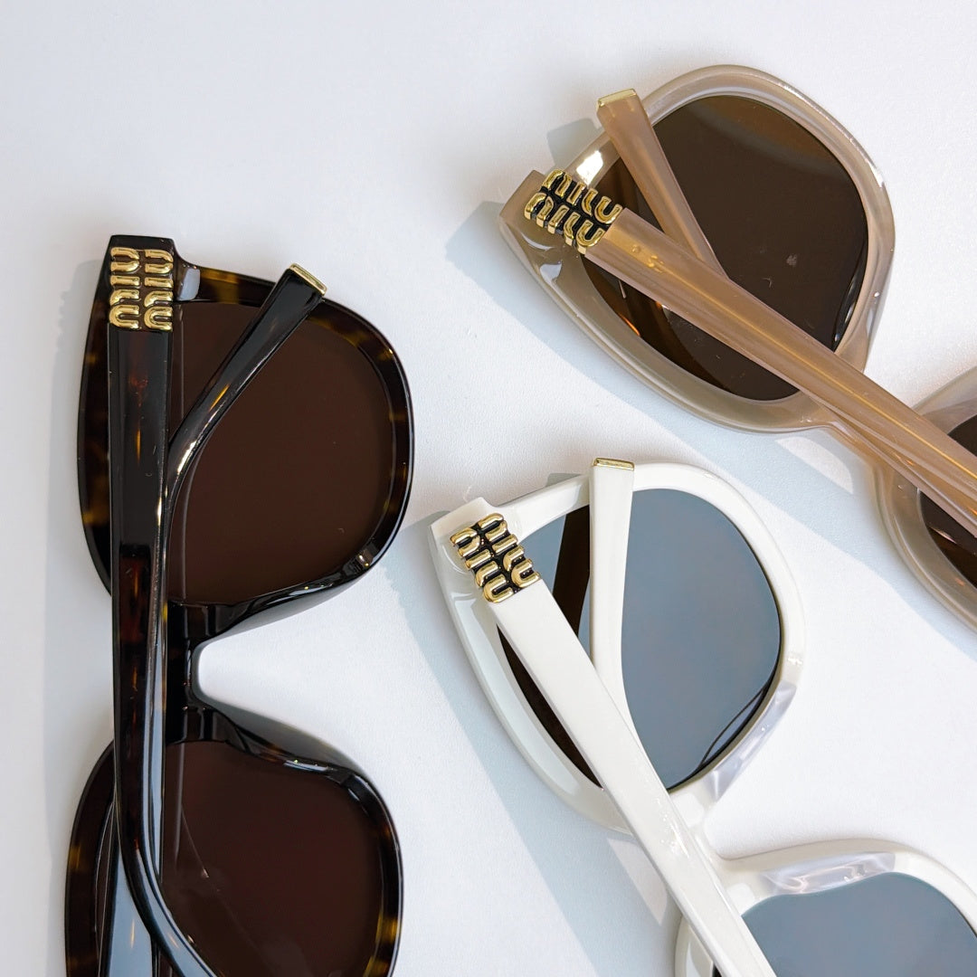 MiuMiu sunglasses in dark and beige frames with brown and amber lenses