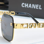 Chanel sunglasses close-up, gold logo temple and dark lenses on black frame