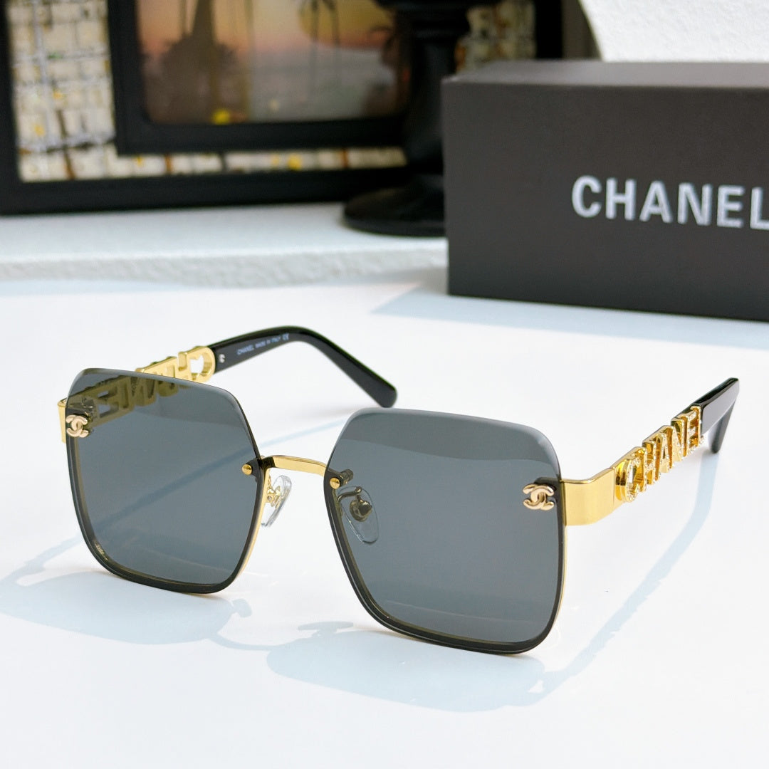 Chanel square sunglasses with gold frame and gray tinted lenses