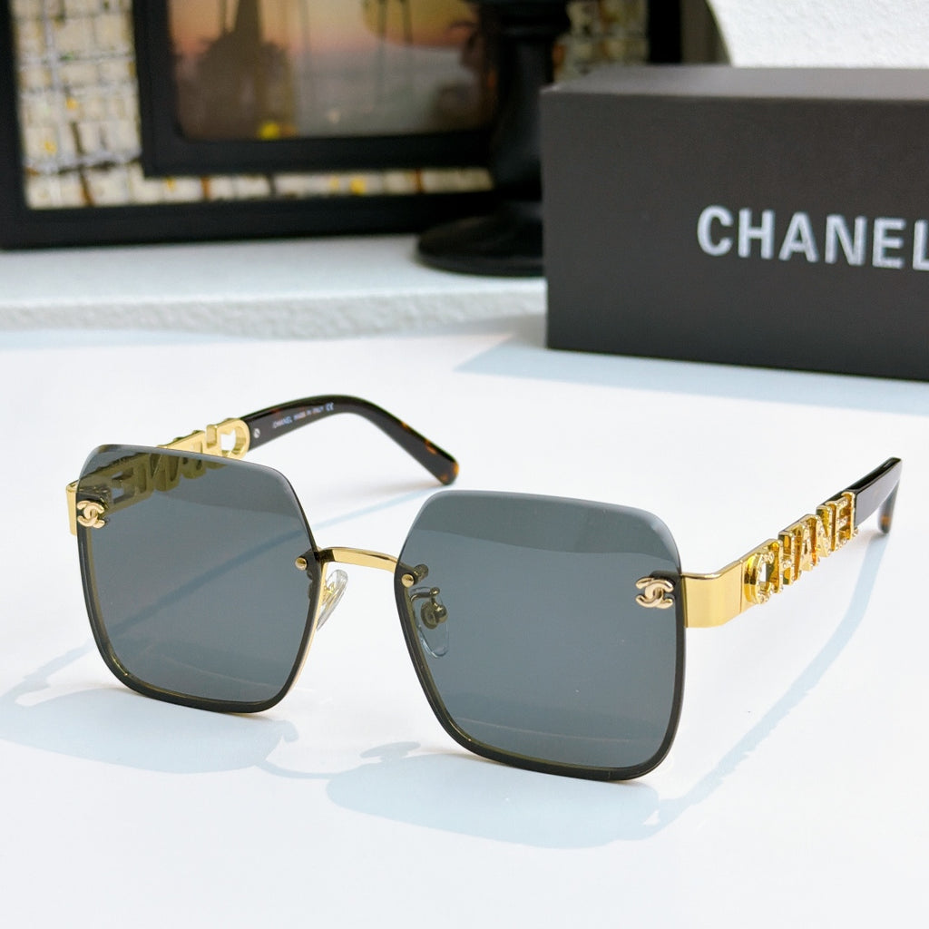 Chanel square sunglasses with gold frame and blue tinted lenses