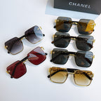 Assorted Chanel sunglasses with gold trim, dark, amber, and red tinted lenses