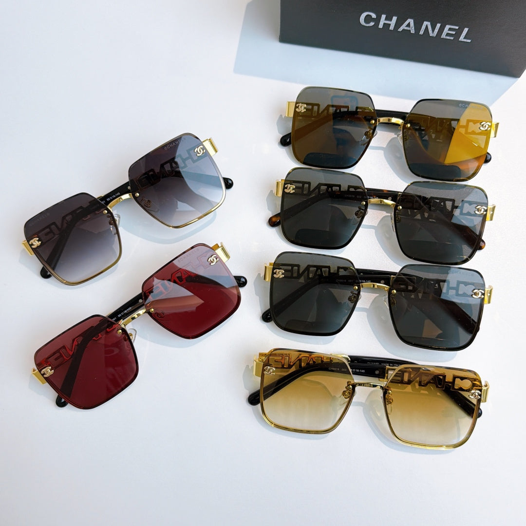 Assorted Chanel sunglasses with gold trim, dark, amber, and red tinted lenses