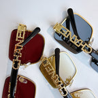 Set of Chanel sunglasses with red, gold, and black frames and tinted lenses