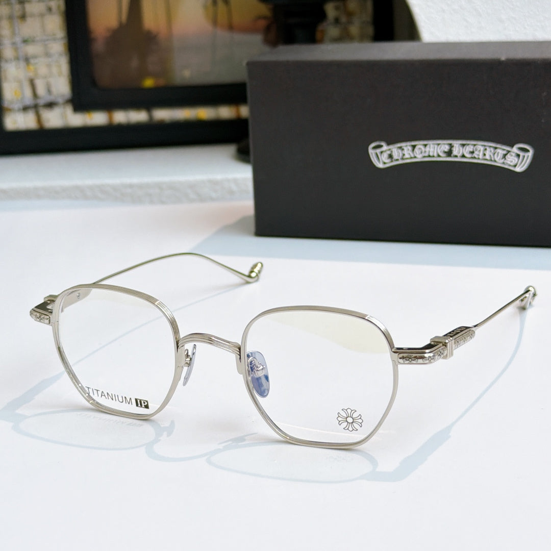 Round eyeglasses with silver frame, blue-tinted lenses, and etched temple arms