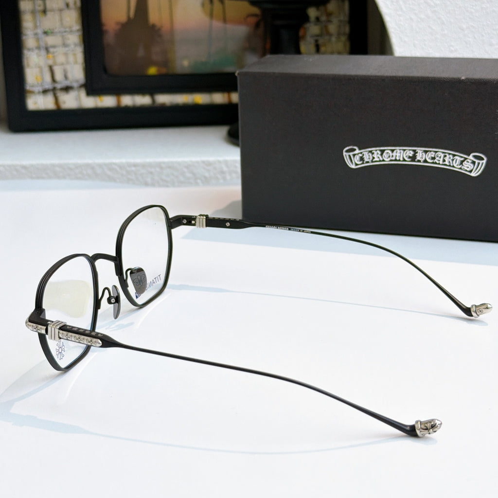 Metal eyeglasses with thin silver frame, dark temples, and blue-tinted lenses