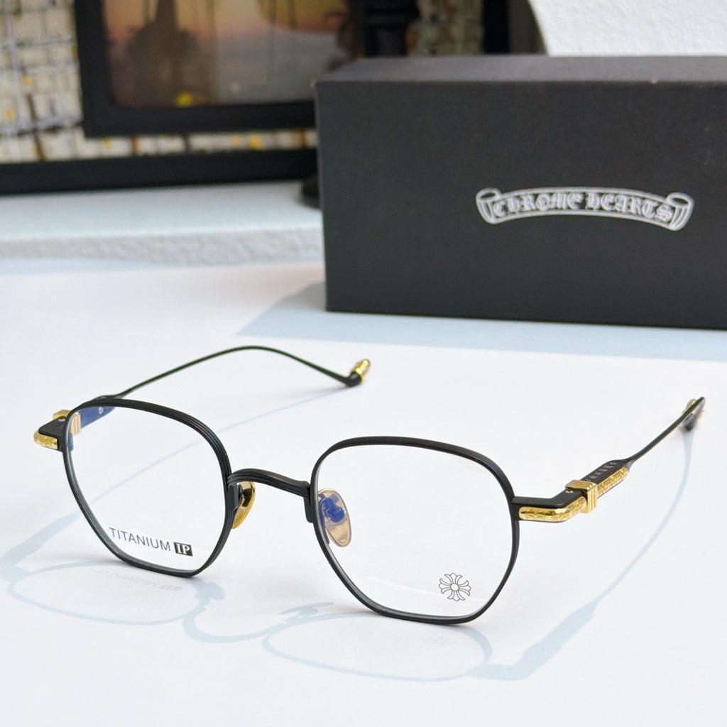 Round eyeglasses with black frame, blue lenses, and gold temple details