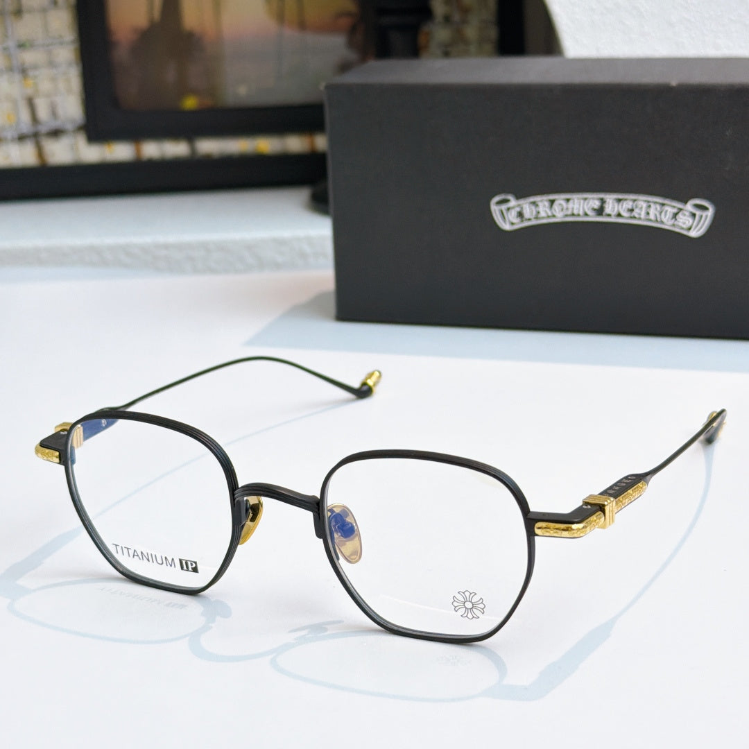 Round eyeglasses with black frame, blue lenses, and gold temple details