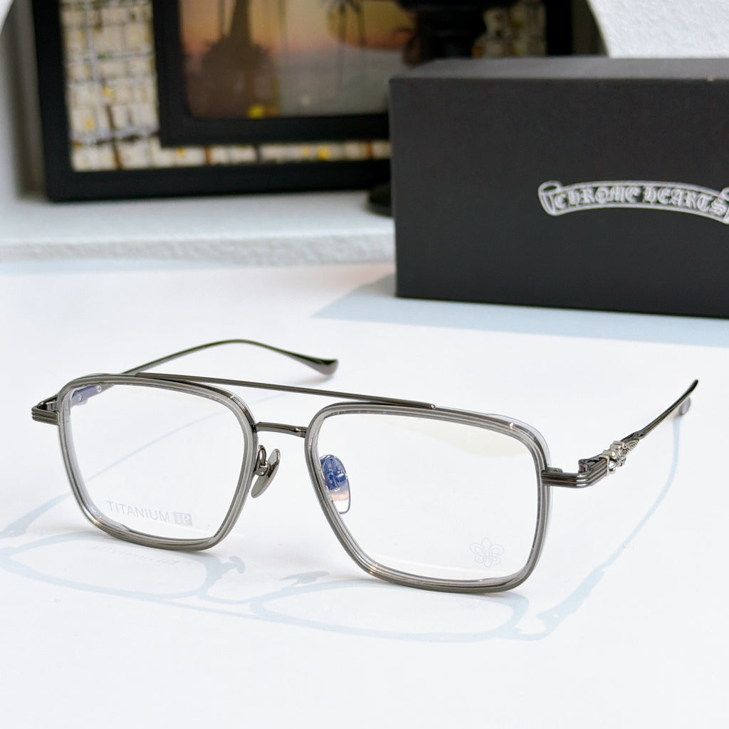 Silver eyeglass frames with clear lenses and decorative metal temple arms