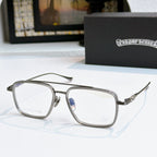 Silver eyeglass frames with clear lenses and decorative metal temple arms