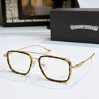 Gold and dark eyeglass frames with clear lenses and thin temples