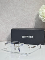 Chrome eyeglasses with silver frame, clear lenses and blue-tinted bridge