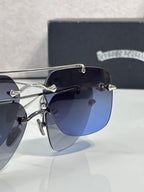 Chrome glasses close-up with navy lenses and silver frame, temple detail