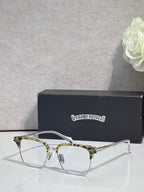 Front view metal eyeglasses with clear lenses, gold accents, and curved frames