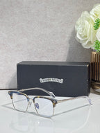 Metal eyeglasses with clear lenses, gold arms, and arched bridge