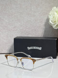 Gold and silver metal eyeglass frame with clear lenses and slim temples