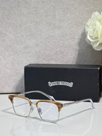 Gold and silver metal eyeglass frame with clear lenses and slim temples