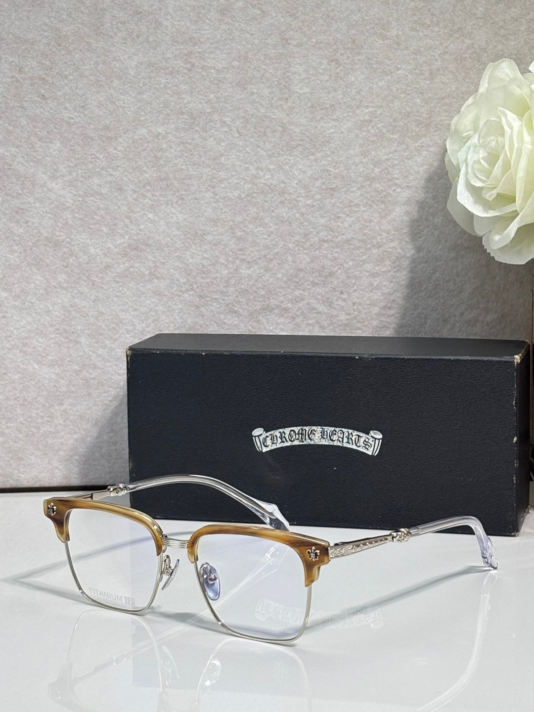 Gold and silver metal eyeglass frame with clear lenses and slim temples