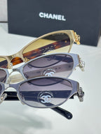 Stacked oval sunglasses with gold and silver frames and gradient dark lenses