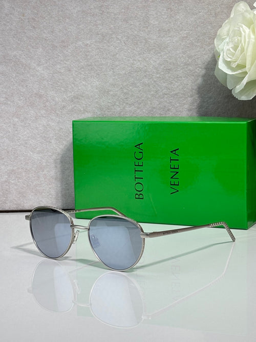 Bottega Veneta round metal sunglasses with dark gray lenses and silver-tone frame