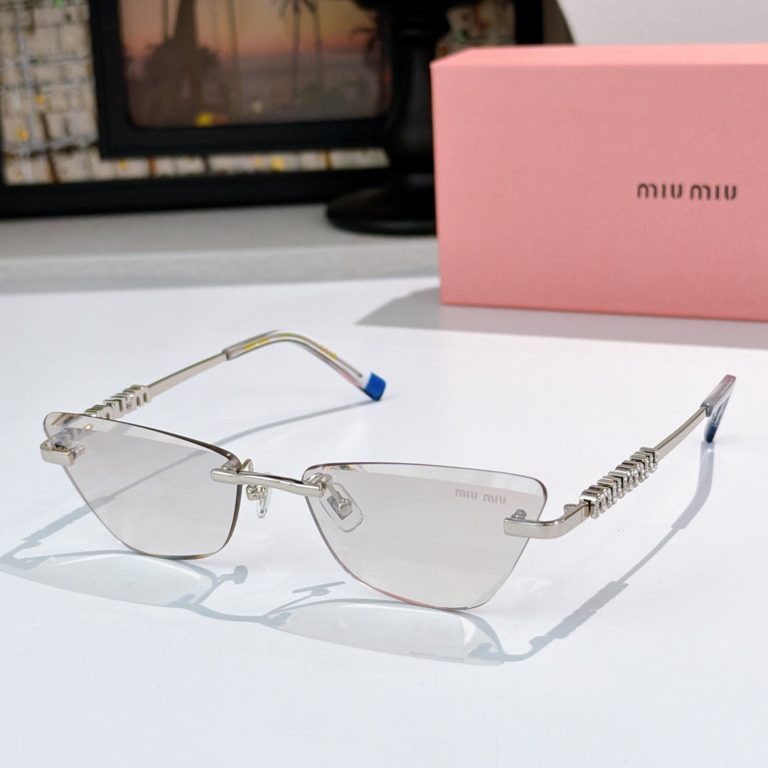 Silver-tone sunglasses with gray-tinted lenses and jeweled chain-style temple detail