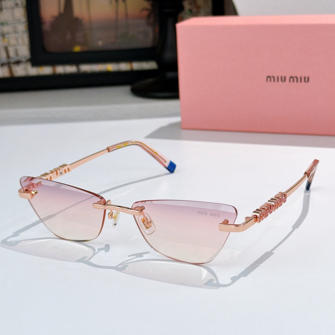 Rose-gold sunglasses with pink-tinted lenses and jeweled chain-style temple detail