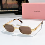 Gold-rim sunglasses with dark tinted lenses and tortoise temple tips