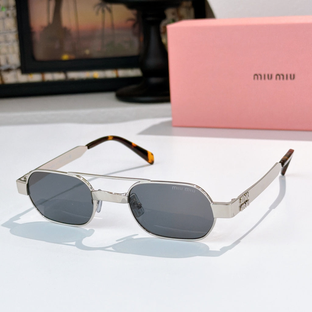 Light gold sunglasses with gray tinted lenses and tortoise temple tips