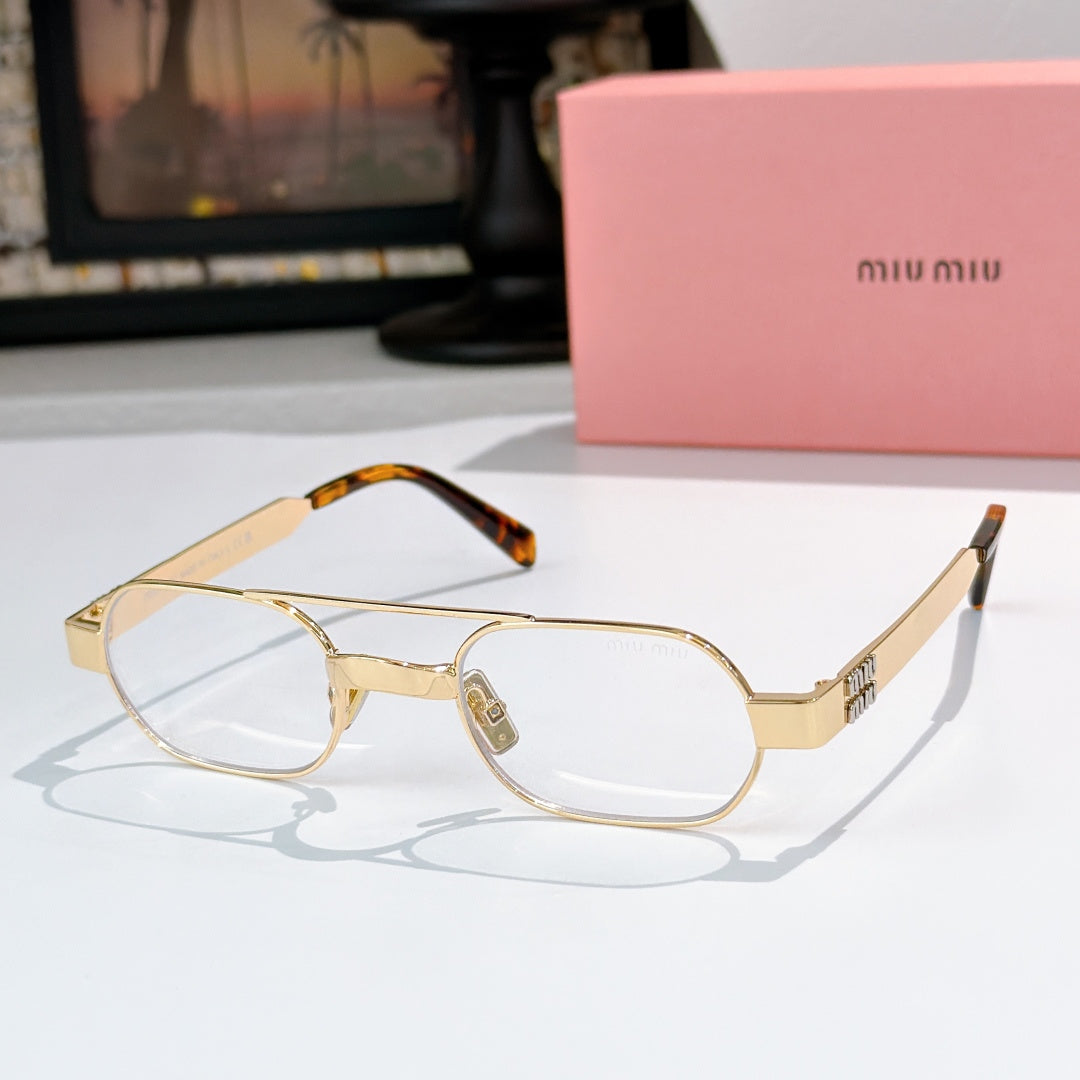 Gold-rim eyeglass frames with clear lenses and tortoise temple tips