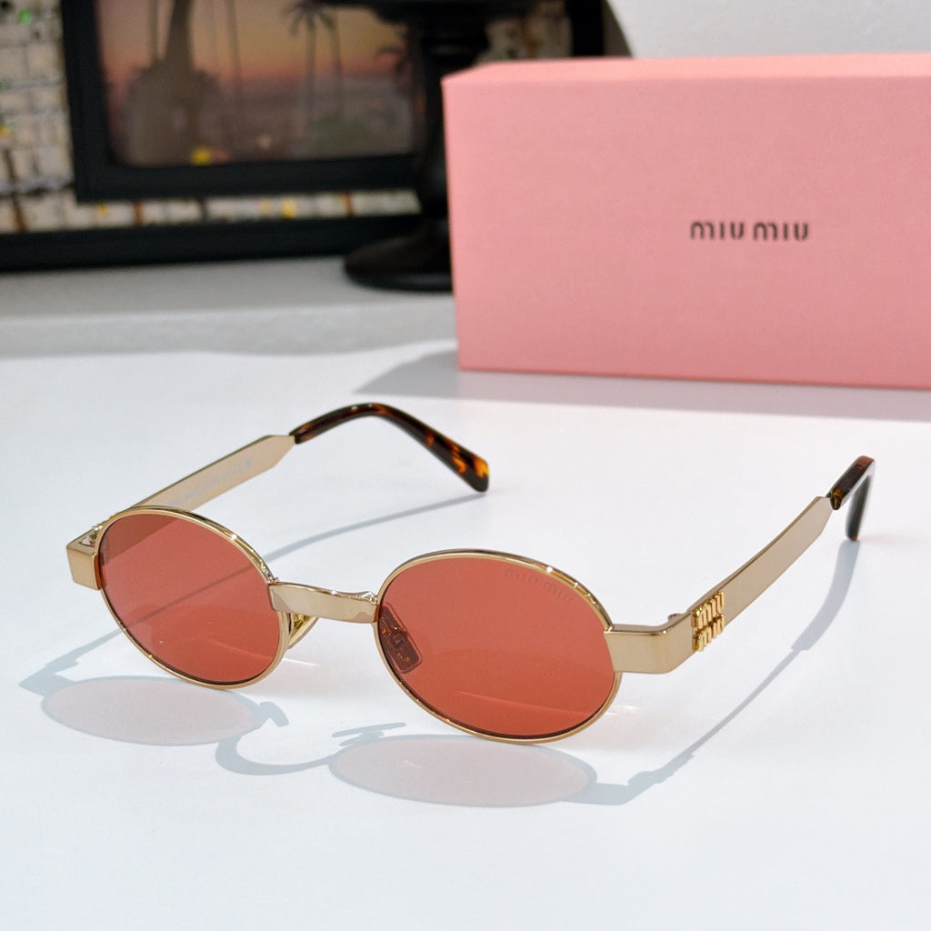 MiuMiu round sunglasses with gold frames, orange lenses, and tortoiseshell temple tips
