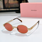 MiuMiu round sunglasses with gold frames, orange lenses, and tortoiseshell temple tips