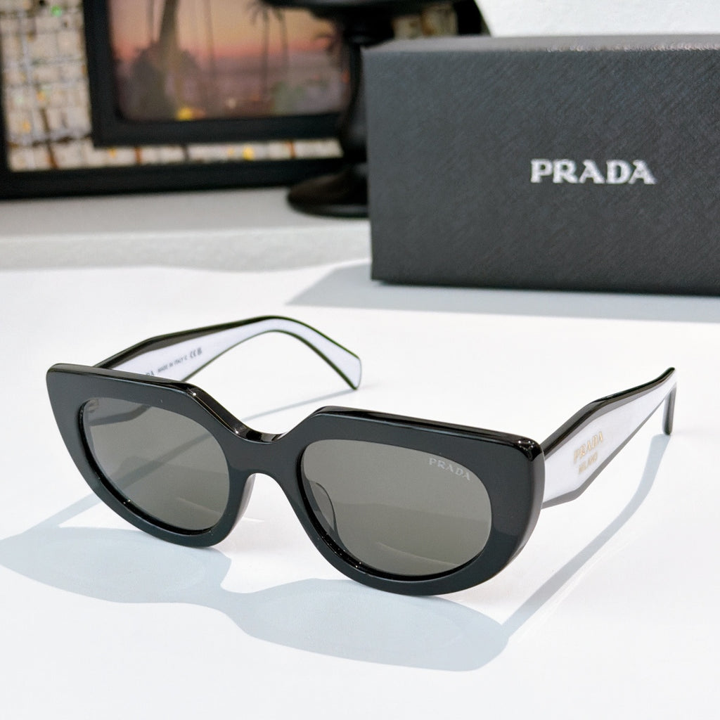 Prada cat-eye sunglasses with dark gray lenses, black frame