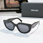 Prada cat-eye sunglasses, side profile, black frame with dark lenses