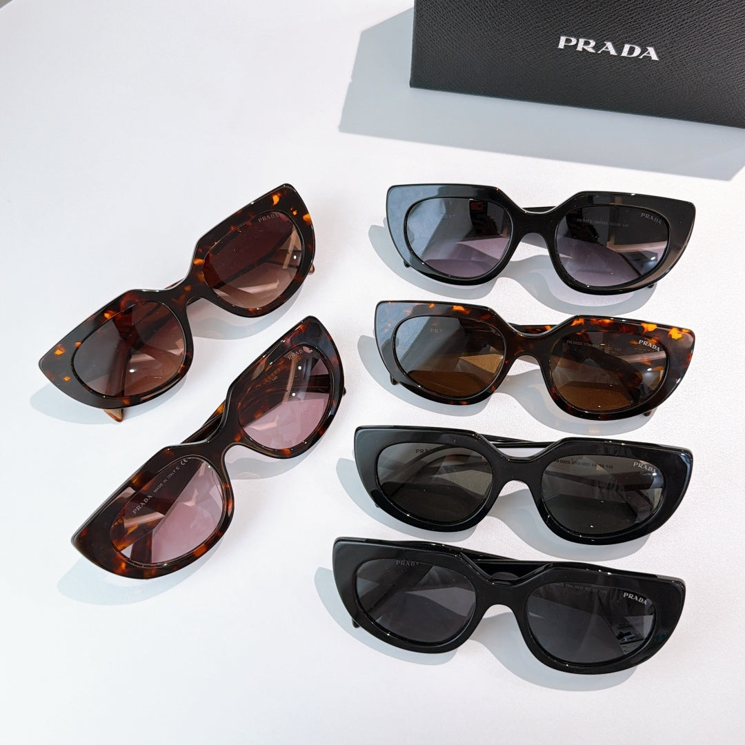 Prada sunglasses assortment: black and tortoiseshell cat-eye frames, dark lenses
