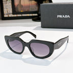 Prada cat-eye sunglasses with purple lenses, black frame