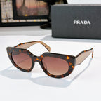 Prada cat-eye sunglasses with pink lenses, tan tortoiseshell frame